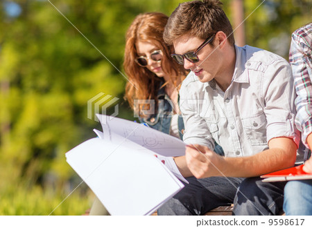 students with books, notebooks, files and folders students with books, notebooks, files and folders 9598617