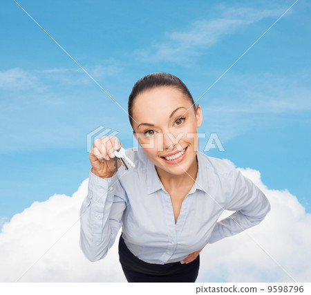 smiling businesswoman with house keys smiling businesswoman with house keys 9598796