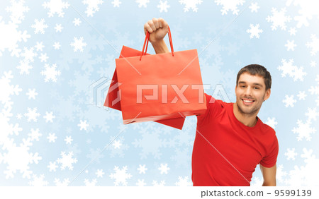 smiling man with shopping bags smiling man with shopping bags 9599139