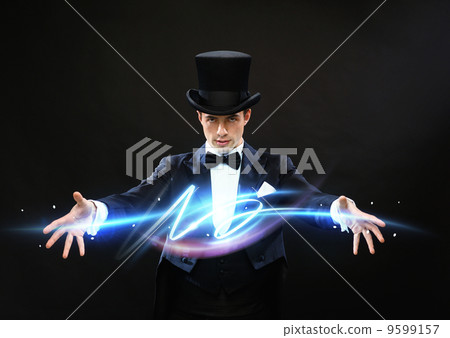 magician in top hat showing trick 9599157