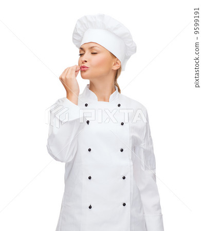 smiling female chef showing delicious sign smiling female chef showing delicious sign 9599191