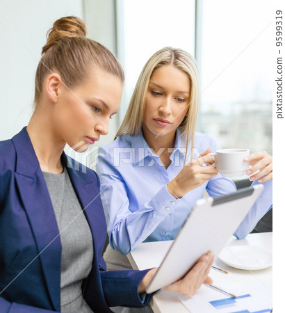 business team with tablet pc having discussion 9599319