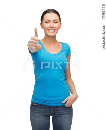 smiling girl in blue t-shirt showing thumbs up 9599466