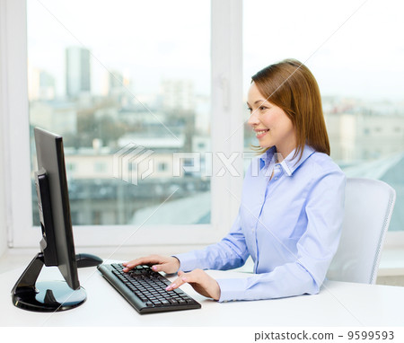 smiling businesswoman or student with computer smiling businesswoman or student with computer 9599593