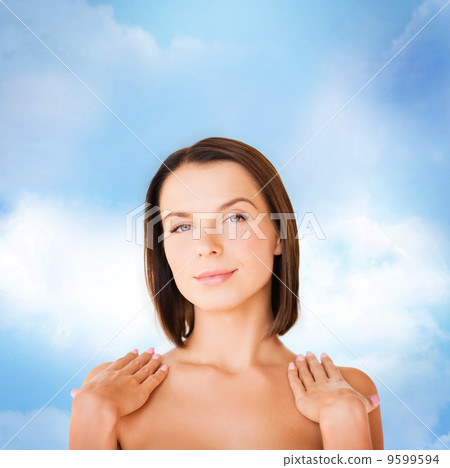 beautiful woman touching her shoulders beautiful woman touching her shoulders 9599594