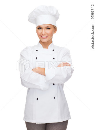 smiling female chef with crossed arms smiling female chef with crossed arms 9599742