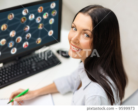 smiling businesswoman with computer smiling businesswoman with computer 9599973