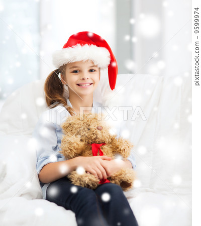 smiling girl in santa helper hat with teddy bear smiling girl in santa helper hat with teddy bear 9599974