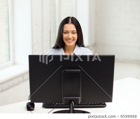 smiling businesswoman or student with computer smiling businesswoman or student with computer 9599988