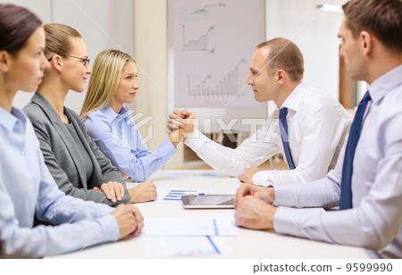 businesswoman and businessman arm wrestling businesswoman and businessman arm wrestling 9599990