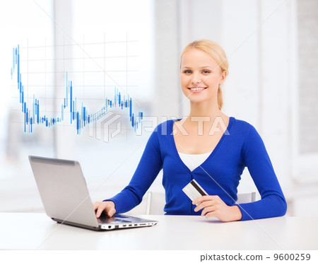 smiling woman with laptop computer and credit card 9600259