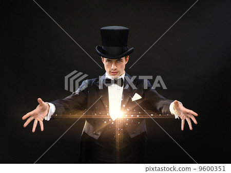 magician in top hat showing trick 9600351