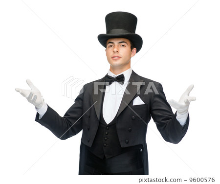 magician in top hat showing trick magician in top hat showing trick 9600576