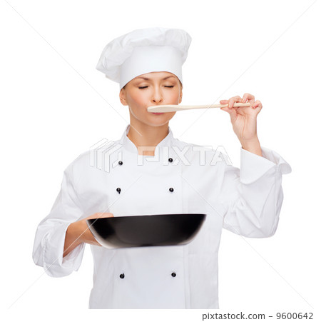 smiling female chef with pan and spoon 9600642