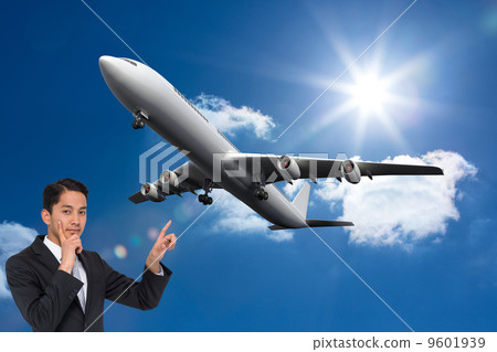 Composite image of thoughtful asian businessman pointing Composite image of thoughtful asian businessman pointing 9601939