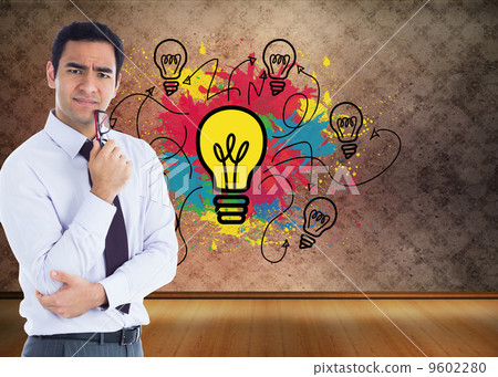 Composite image of thinking businessman holding glasses 9602280