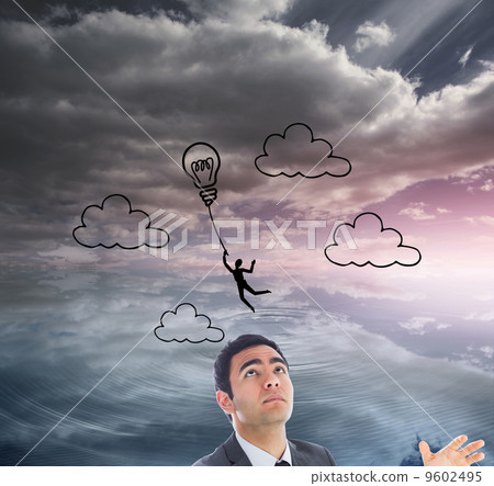 Composite image of unsmiling businessman catching Composite image of unsmiling businessman catching 9602495