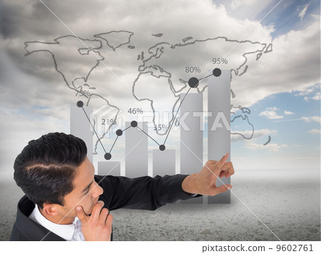 Composite image of thoughtful asian businessman pointing Composite image of thoughtful asian businessman pointing 9602761