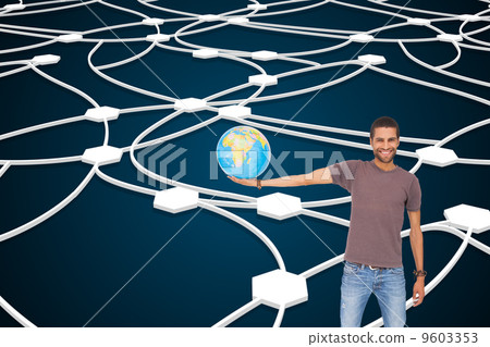 Composite image of handsome man holding out a globe Composite image of handsome man holding out a globe 9603353