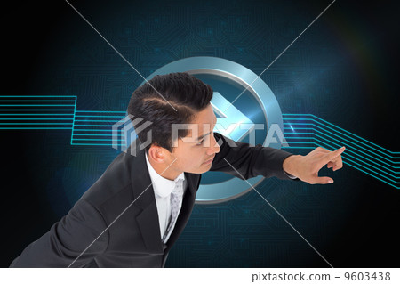 Composite image of unsmiling asian businessman pointing 9603438