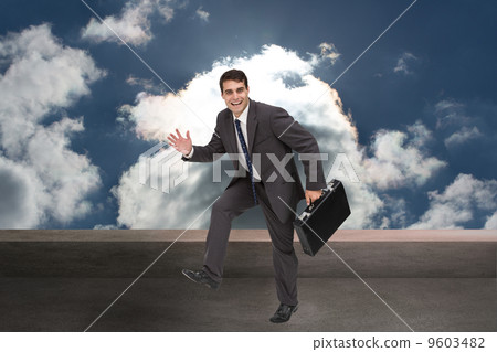 Composite image of cheerful businessman in a hury 9603482
