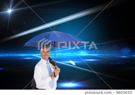 Composite image of businessman holding umbrella smiling at camer Composite image of businessman holding umbrella smiling at camer 9603650