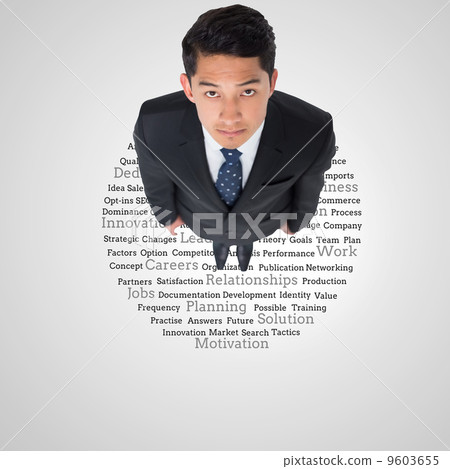 Composite image of serious asian businessman 9603655