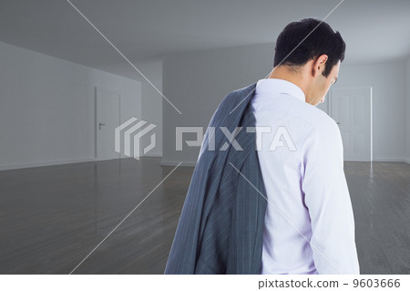 Composite image of unsmiling businessman standing 9603666