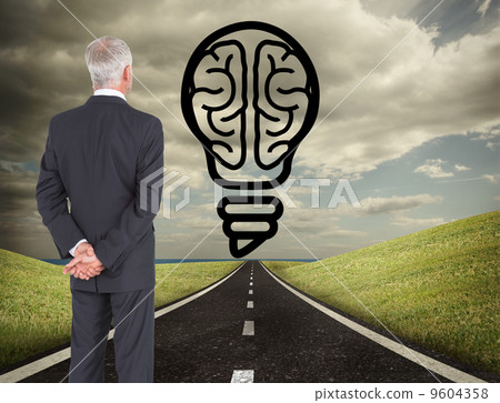 Composite image of rear view of mature businessman posing Composite image of rear view of mature businessman posing 9604358