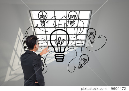 Composite image of asian businessman pointing Composite image of asian businessman pointing 9604472