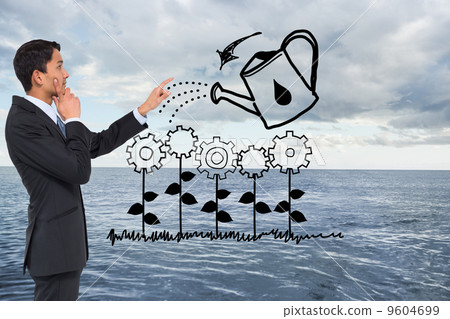 Composite image of thoughtful asian businessman pointing 9604699