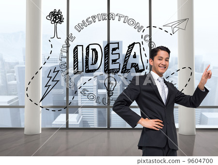 Composite image of smiling asian businessman pointing 9604700