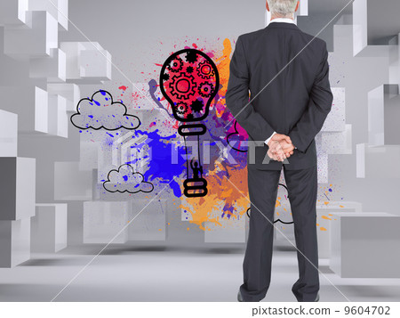 Composite image of rear view of serious businessman posing Composite image of rear view of serious businessman posing 9604702