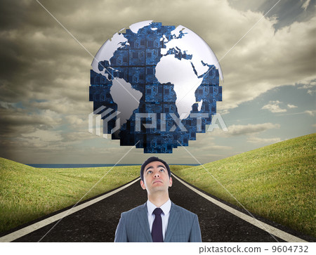 Composite image of unsmiling businessman standing 9604732