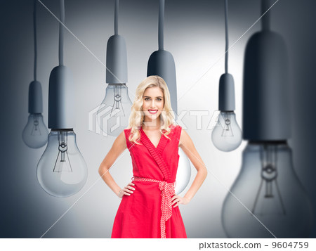 Composite image of smiling blonde standing hands on hips Composite image of smiling blonde standing hands on hips 9604759