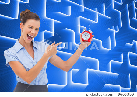 Composite image of businesswoman indicating alarm clock Composite image of businesswoman indicating alarm clock 9605399
