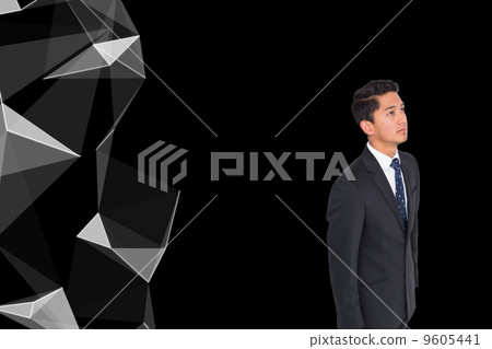 Composite image of frowning businessman looking up Composite image of frowning businessman looking up 9605441