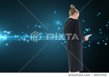 Composite image of businesswoman holding new tablet Composite image of businesswoman holding new tablet 9605448
