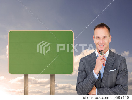 Composite image of smiling businessman holding glasses Composite image of smiling businessman holding glasses 9605450