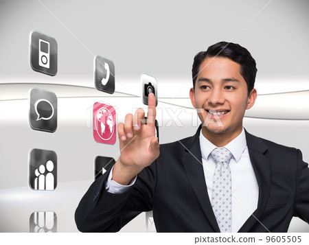 Composite image of smiling asian businessman pointing Composite image of smiling asian businessman pointing 9605505