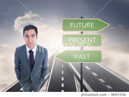 Composite image of unsmiling businessman standing Composite image of unsmiling businessman standing 9605506