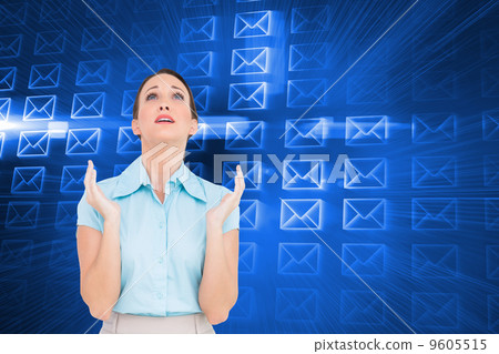 Composite image of concerned young businesswoman praying 9605515