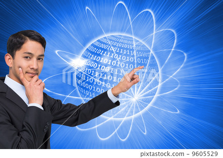Composite image of thoughtful asian businessman pointing Composite image of thoughtful asian businessman pointing 9605529