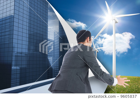 Composite image of businessman catching 9605837