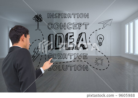 Composite image of serious asian businessman pointing 9605988