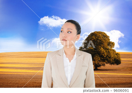 Composite image of unsmiling asian businesswoman 9606091