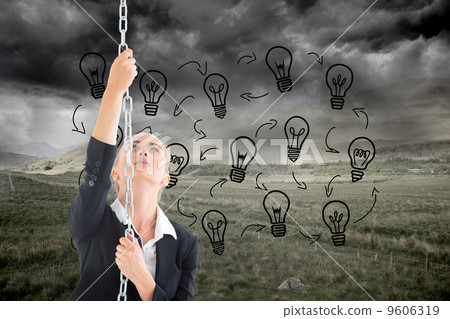 Composite image of businesswoman pulling a chain Composite image of businesswoman pulling a chain 9606319