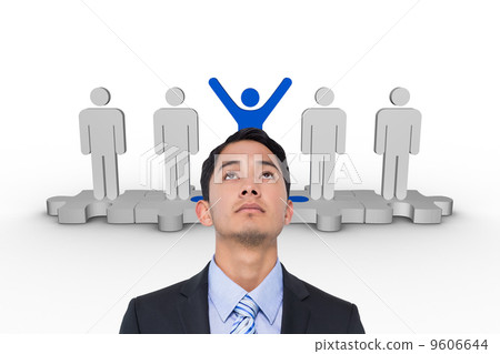 Composite image of serious asian businessman 9606644