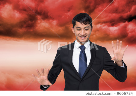 Composite image of smiling businessman touching Composite image of smiling businessman touching 9606784