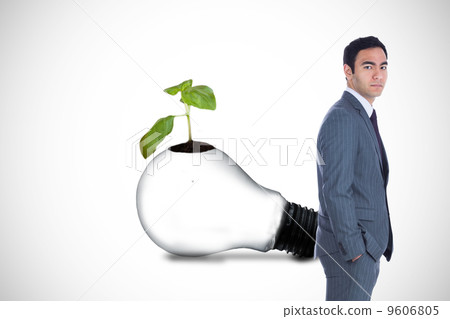 Composite image of unsmiling businessman standing Composite image of unsmiling businessman standing 9606805